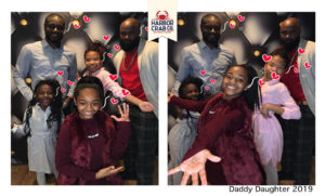 A photo of a family smiling for the Daddy Daughter 2019 event.